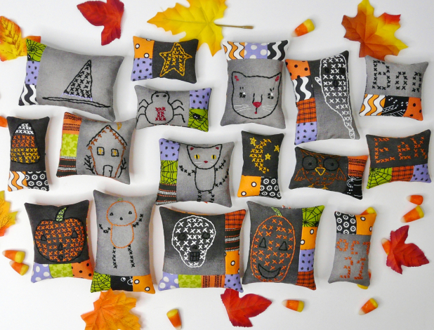 Halloween embroidery patchwork ornaments on dark fabric pattern