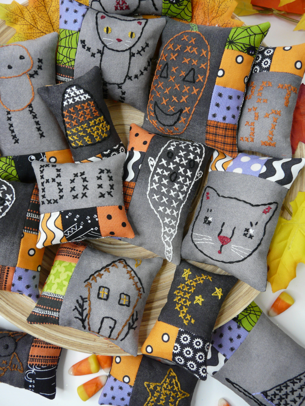 Halloween embroidery patchwork ornaments on dark fabric pattern